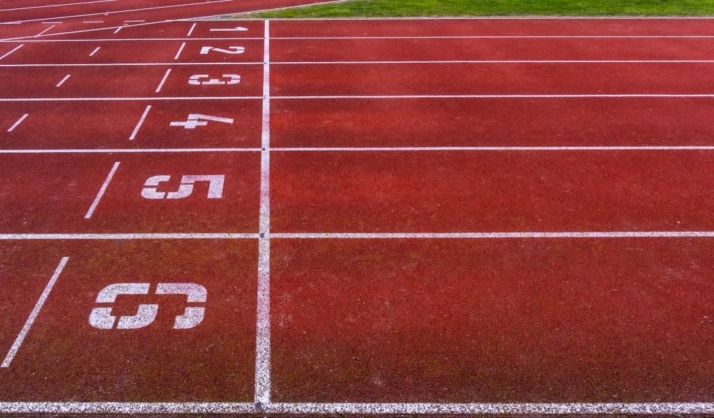 The start of a sprint track - a red surface on which six numbered corridors are painted in white.