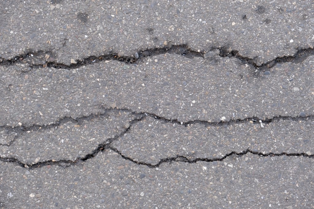 Close-up of cracks in a sidewalk