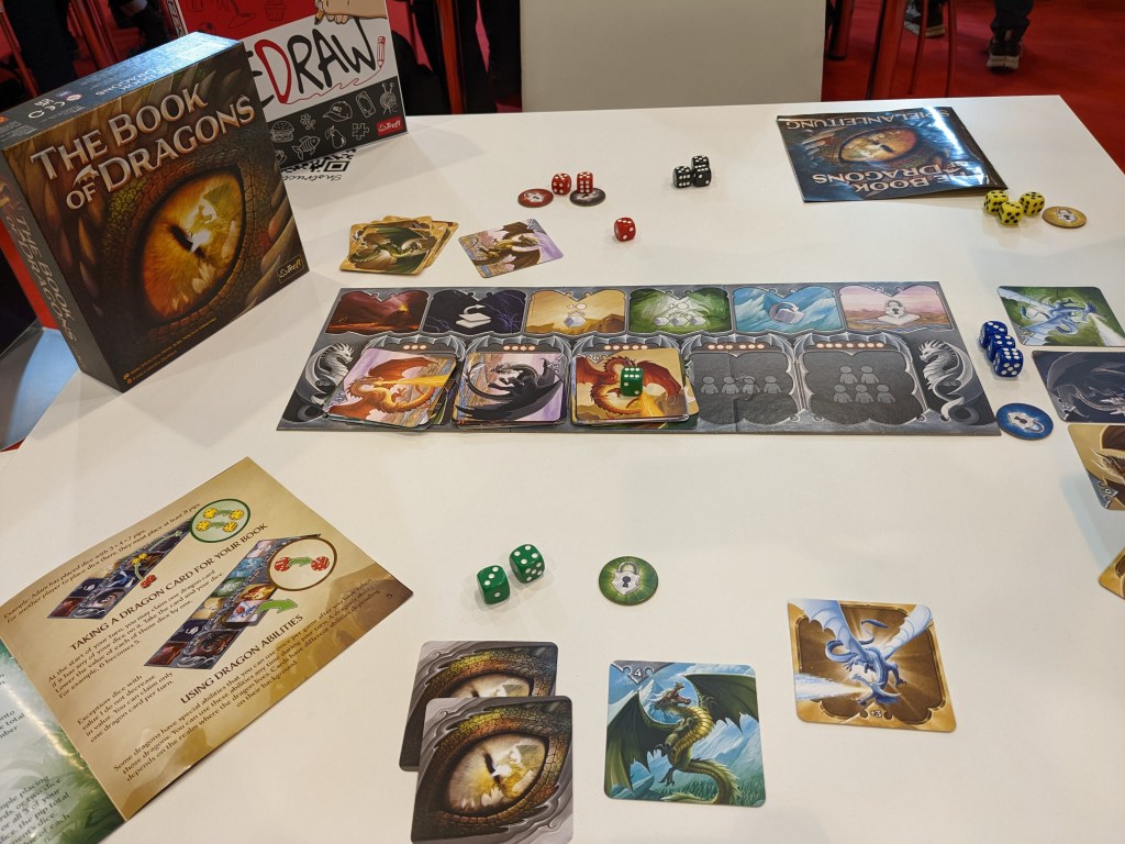 The Book of Dragons - dragon pictures and dice.