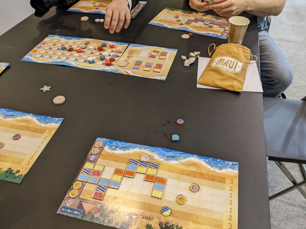 Maui - colorful tiles, representing beach towels on yellow sand.