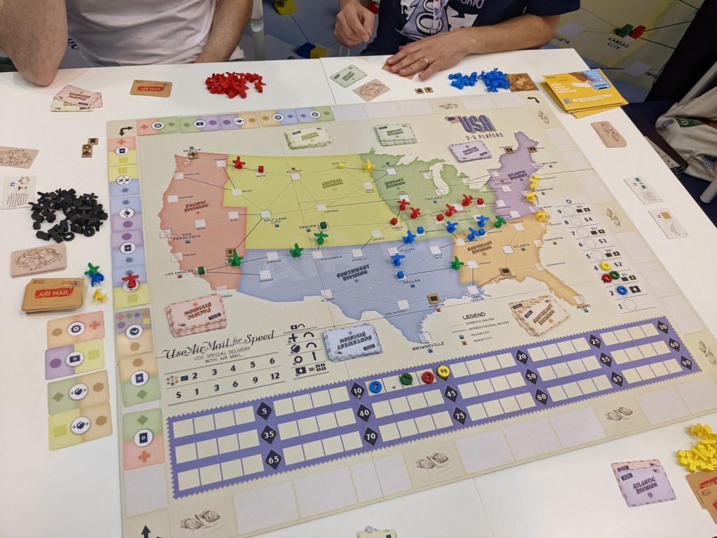 Air Mail - a map of the US with little planes and cubes on it. There's a track around the map made of colored domino cards.