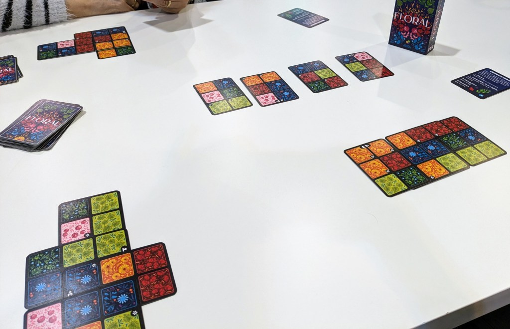 Floral: Cards split in six sections of different colored flower patterns, laid on top of each other to create larger surfaces.