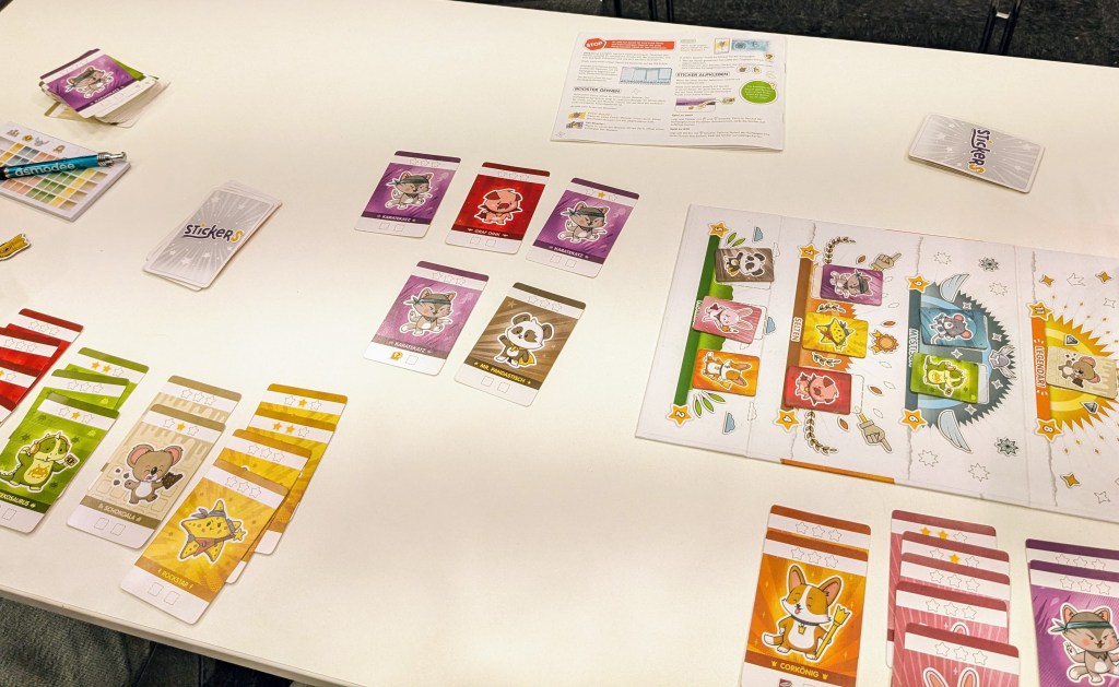 Stickers: cards with cartoon characters, ordered by type in sets, and board depicting the current value of the characters on the cards