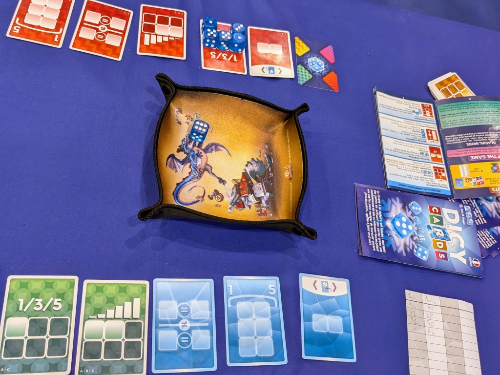 Dicy Cards: cards with places for dice, blue dice and a dice tray