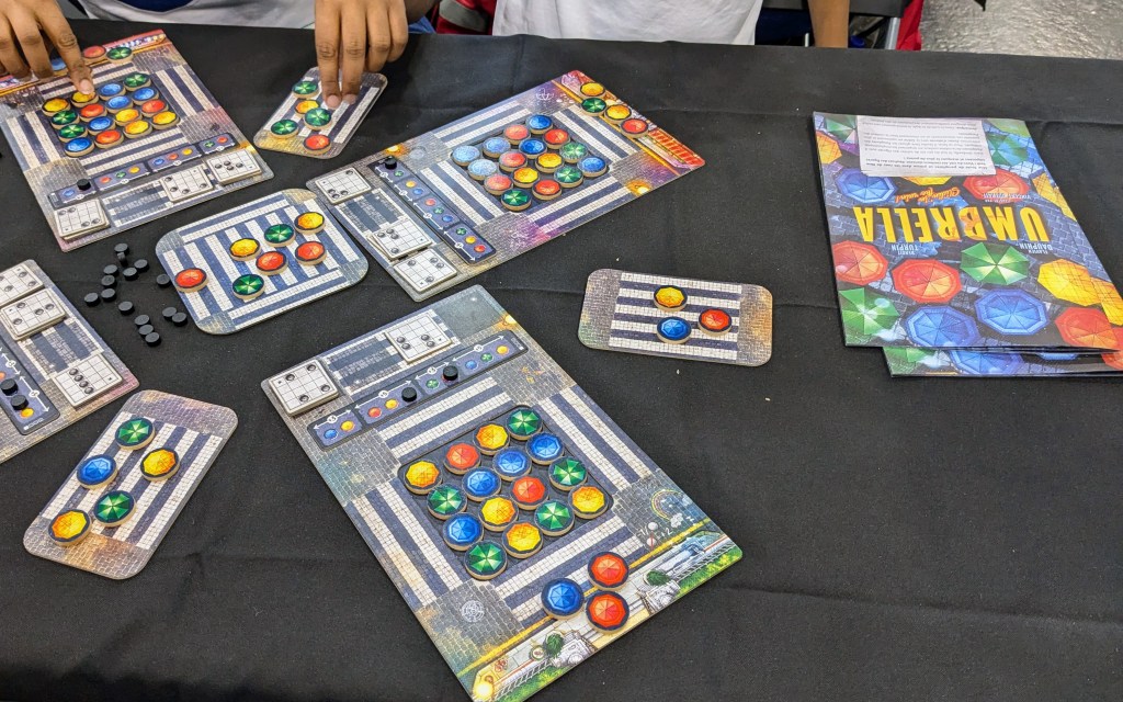 Umbrella: player boards with a 4×4 grid of colorful umbrella tokens