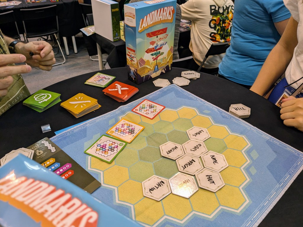 Landmarks: hexagonal tiles with words handwritten on them (Mickey Ears, Lobse, Mascot, Hut...), and tiles with hex maps on them