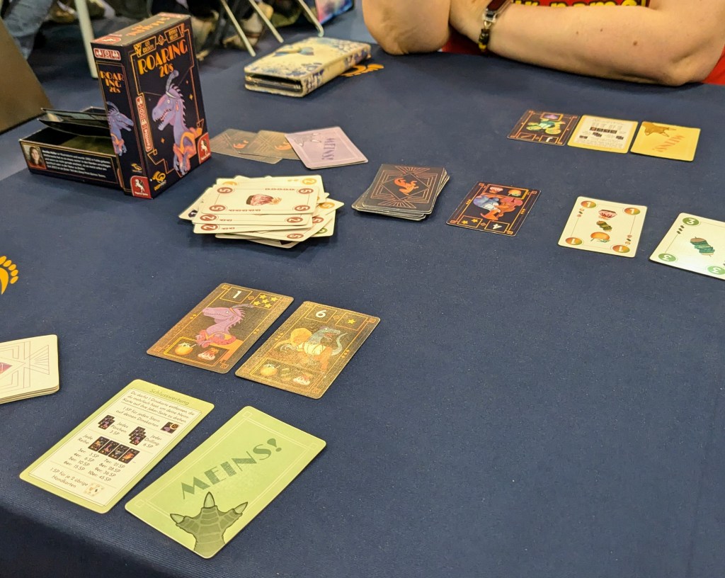 Roaring 20s: cards with dinosaurs with numbers and stars; cards with food and numbers