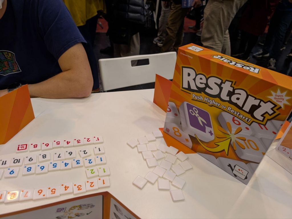 Colored plastic tiles numbered from 1 to 16, in ascending order.